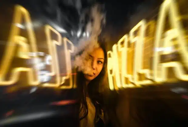 woman near yellow neon sign